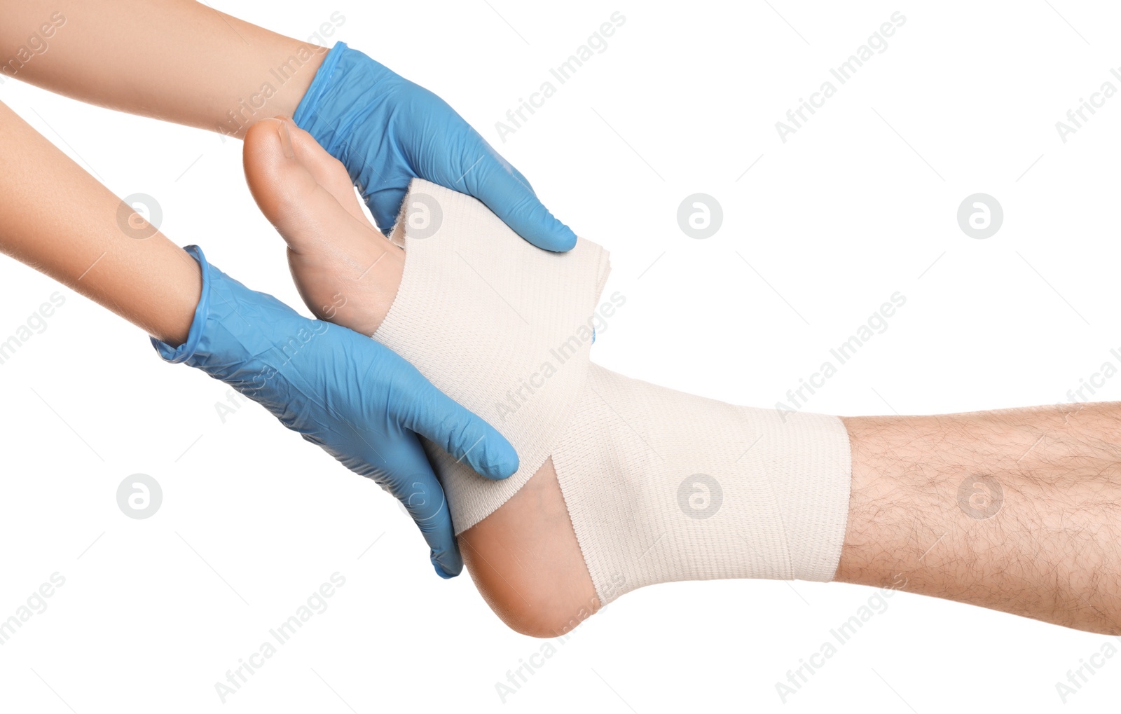 Photo of Doctor applying medical bandage onto patient's foot on white background, closeup