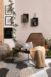 Lounge area interior with comfortable armchair and beautiful houseplants