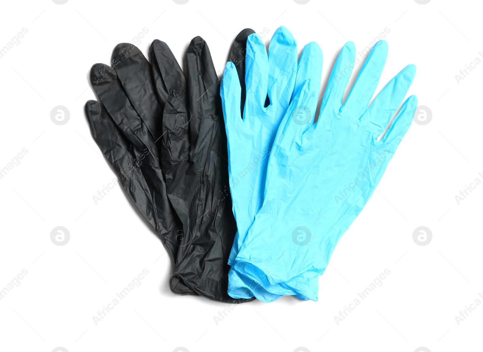 Photo of Different medical gloves on white background, top view