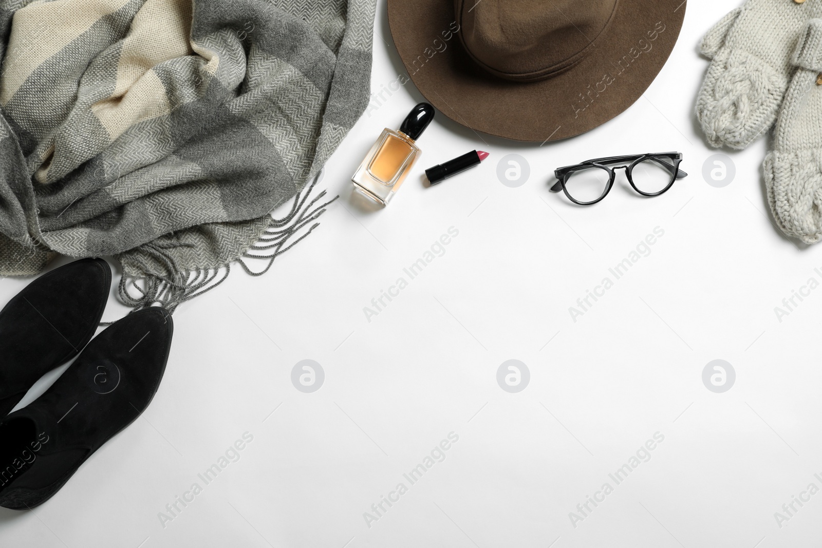 Photo of Flat lay composition with female winter clothes and space for text on white background