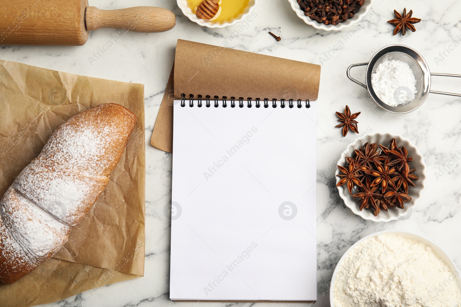 Photo of Blank recipe book, cooking utensils and ingredients on white marble table, flat lay. Space for text