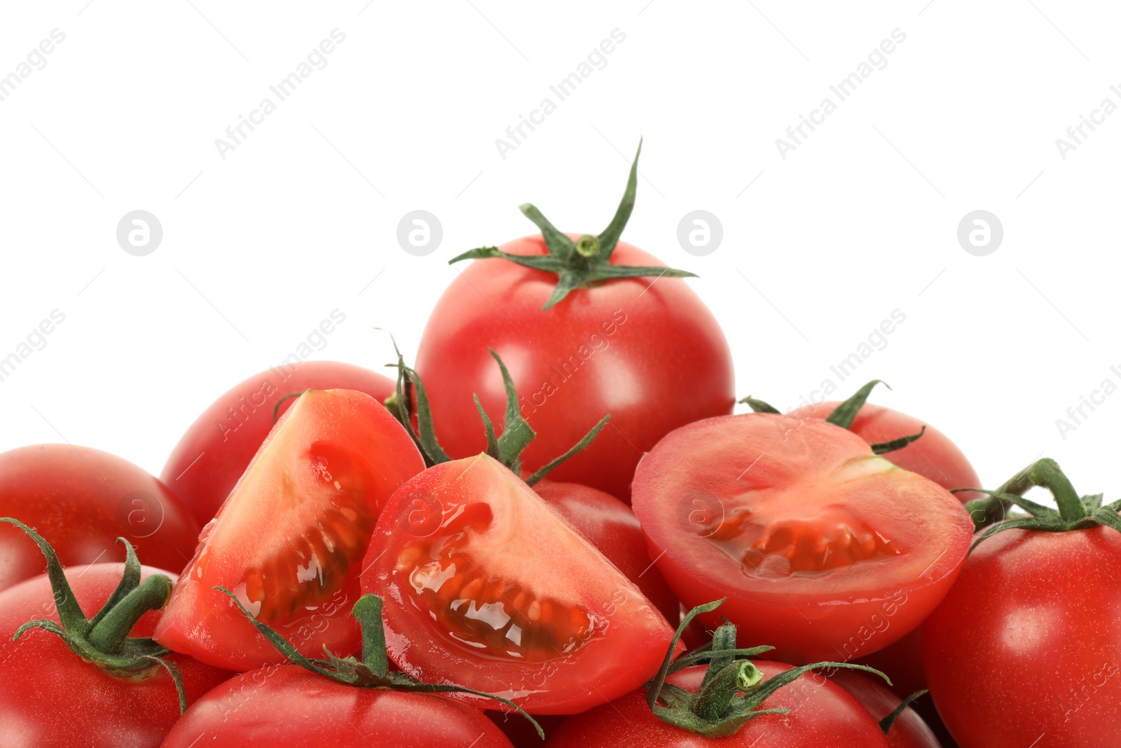 Photo of Whole and cut cherry tomatoes isolated on white, closeup