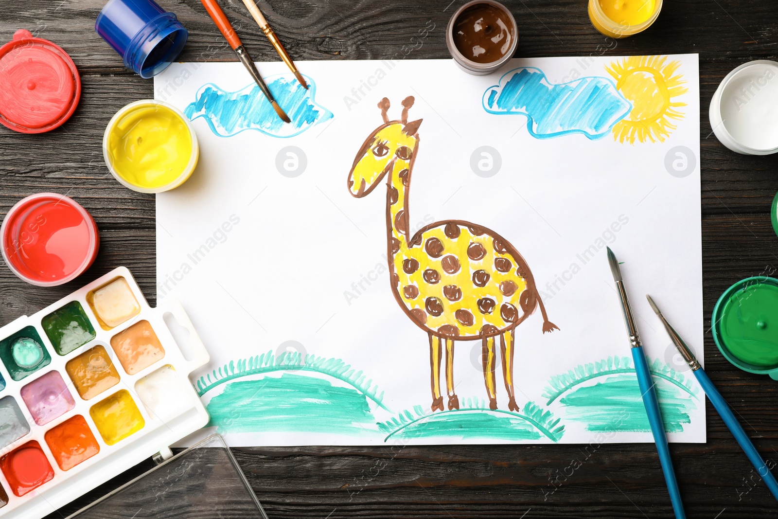 Photo of Flat lay composition with child's painting of giraffe on table
