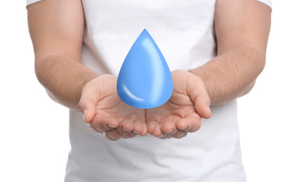 Image of Man holding water drop on white background, closeup. Ecology protection