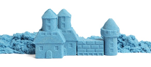 Castle made of blue kinetic sand isolated on white