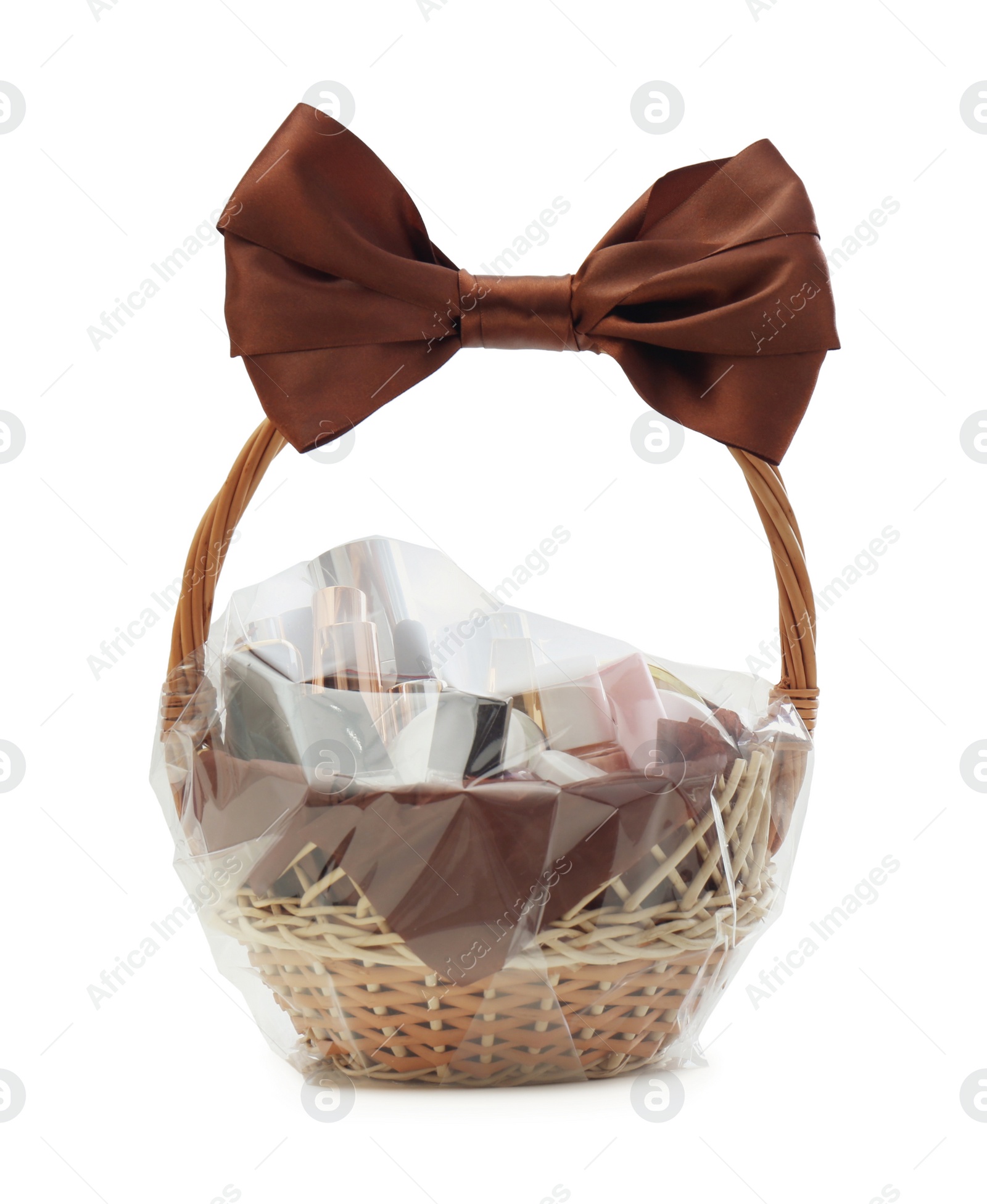 Photo of Wicker gift basket with cosmetic products isolated on white