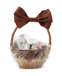 Wicker gift basket with cosmetic products isolated on white