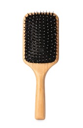 One new wooden hairbrush isolated on white