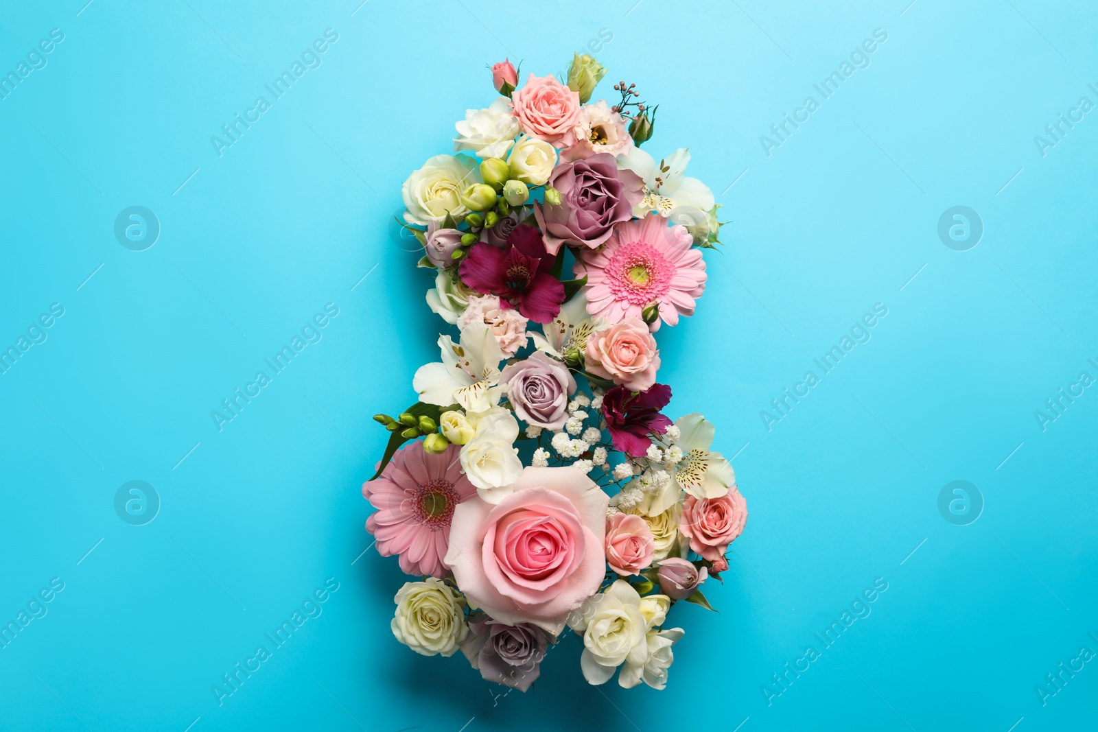 Photo of Number 8 made of beautiful flowers on light blue background, flat lay. International Women's day