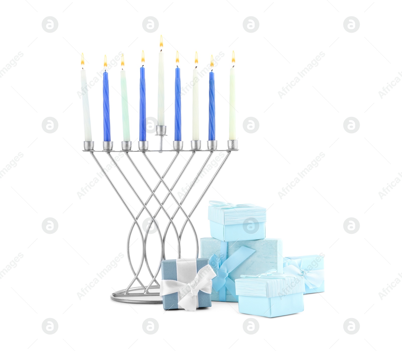 Photo of Hanukkah celebration. Menorah with candles and gift boxes isolated on white