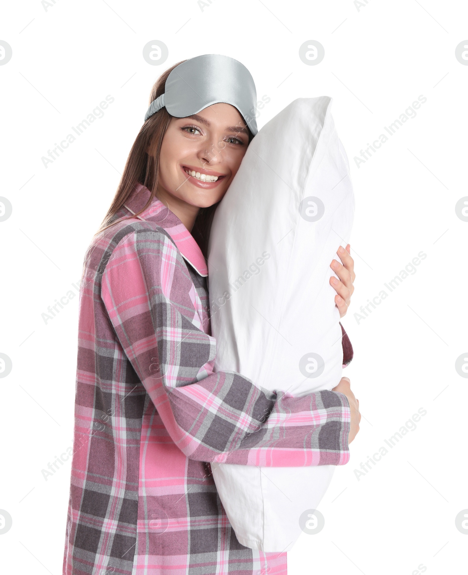 Photo of Young woman with pillow and sleep mask on white background