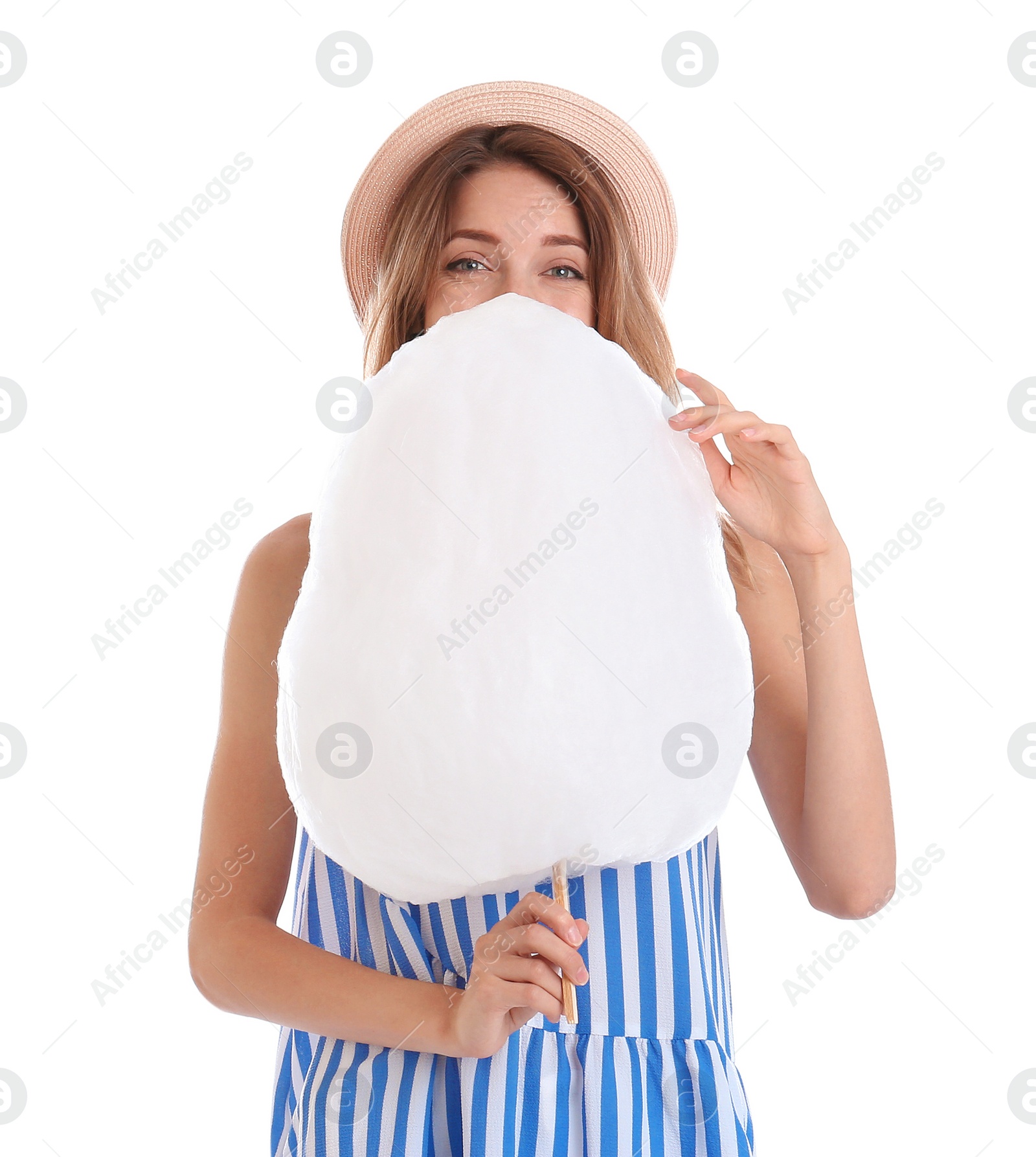 Photo of Happy young woman with cotton candy on white background