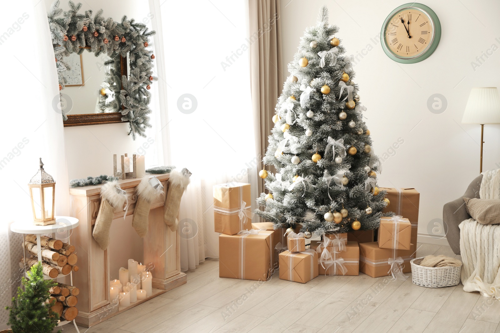 Photo of Stylish Christmas interior with beautiful decorated tree and fireplace