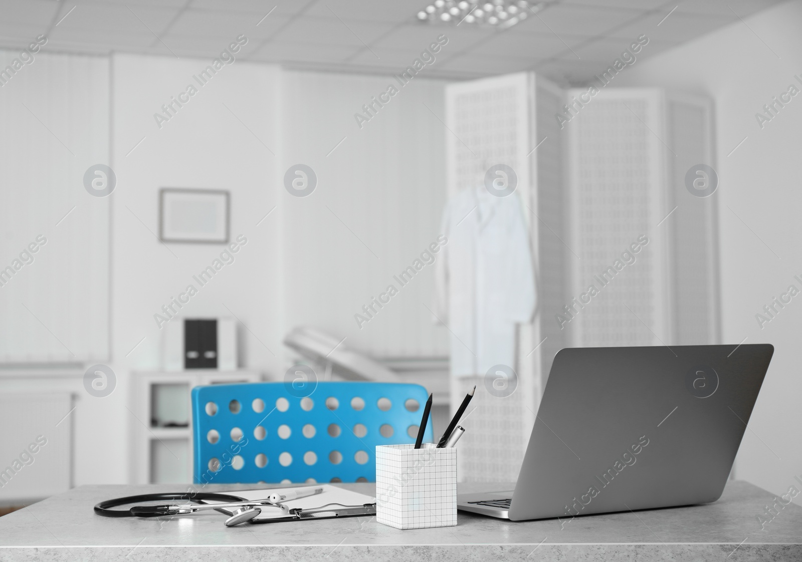 Photo of Doctor's workplace with laptop in modern clinic