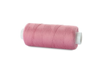 Photo of Spool of pink sewing thread isolated on white