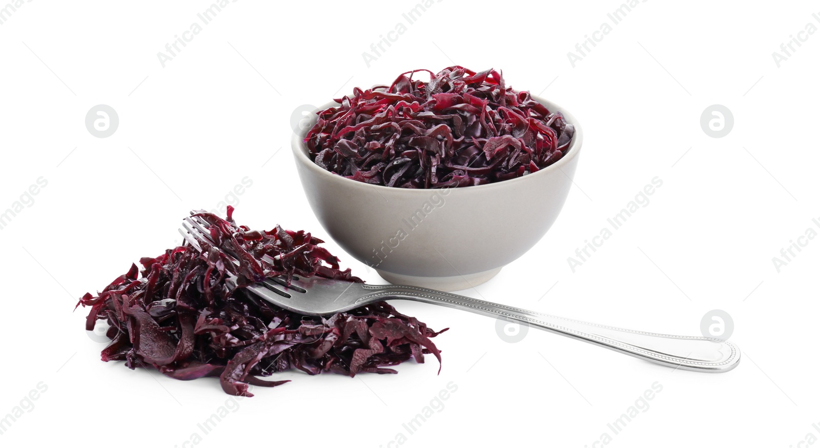 Photo of Bowl and spoon with tasty red cabbage sauerkraut isolated on white