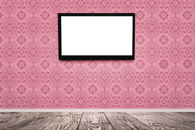 Image of Modern TV on pink wall in room. Space for design