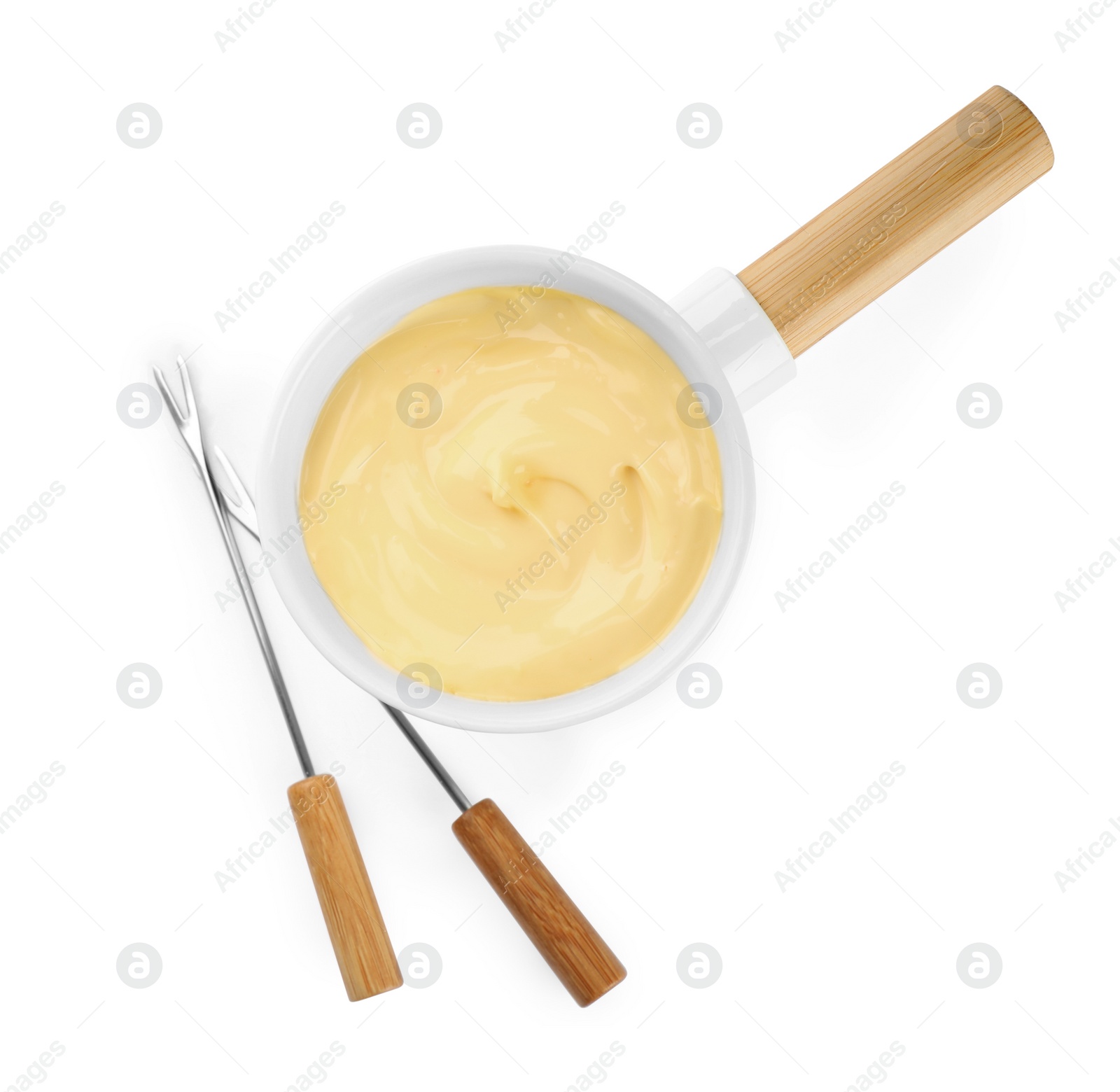 Photo of Pot of tasty cheese fondue and forks isolated on white, top view