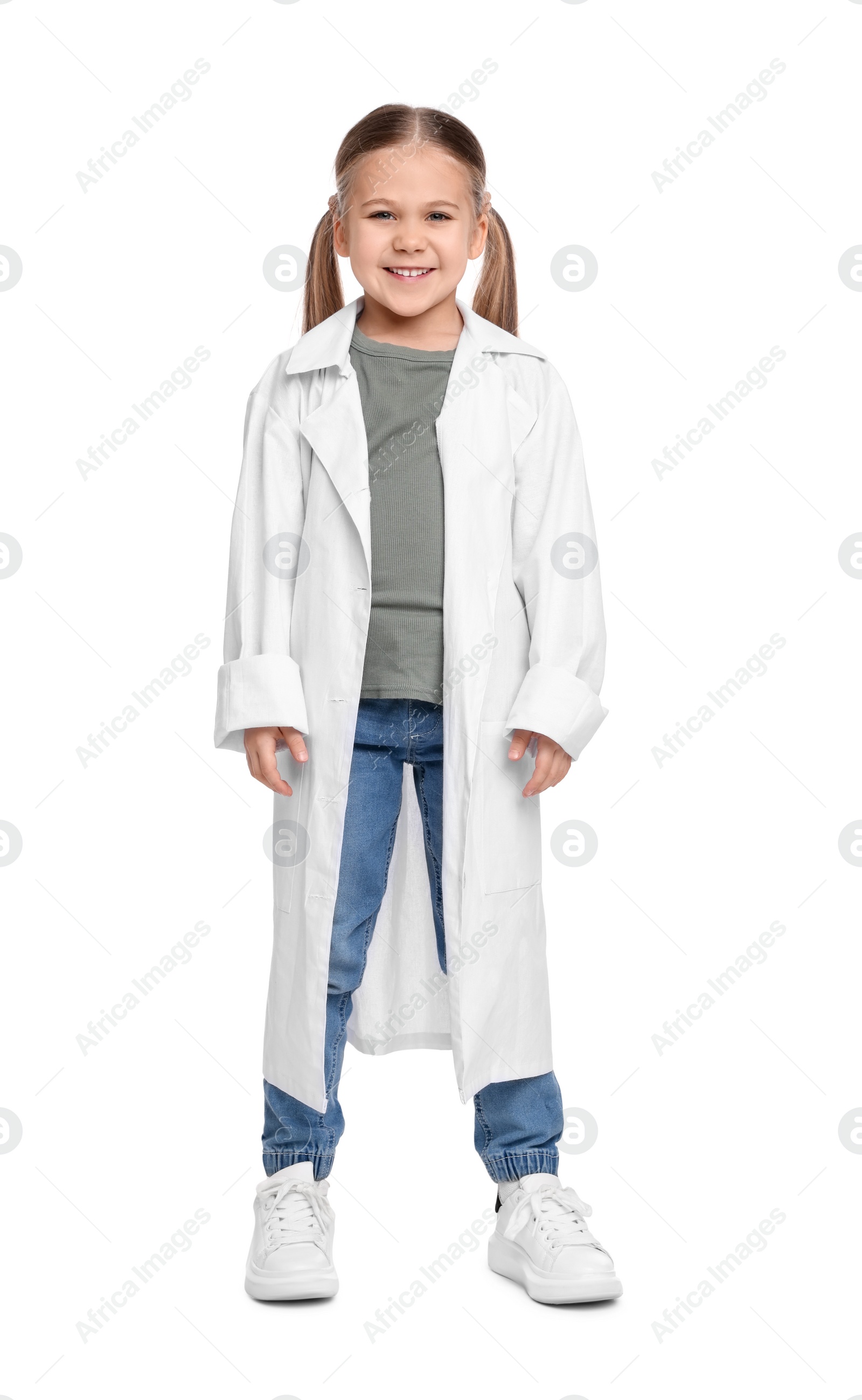 Photo of Full length portrait of little girl in medical uniform on white background