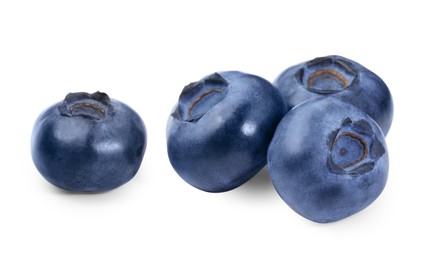 Photo of Many fresh ripe blueberries isolated on white