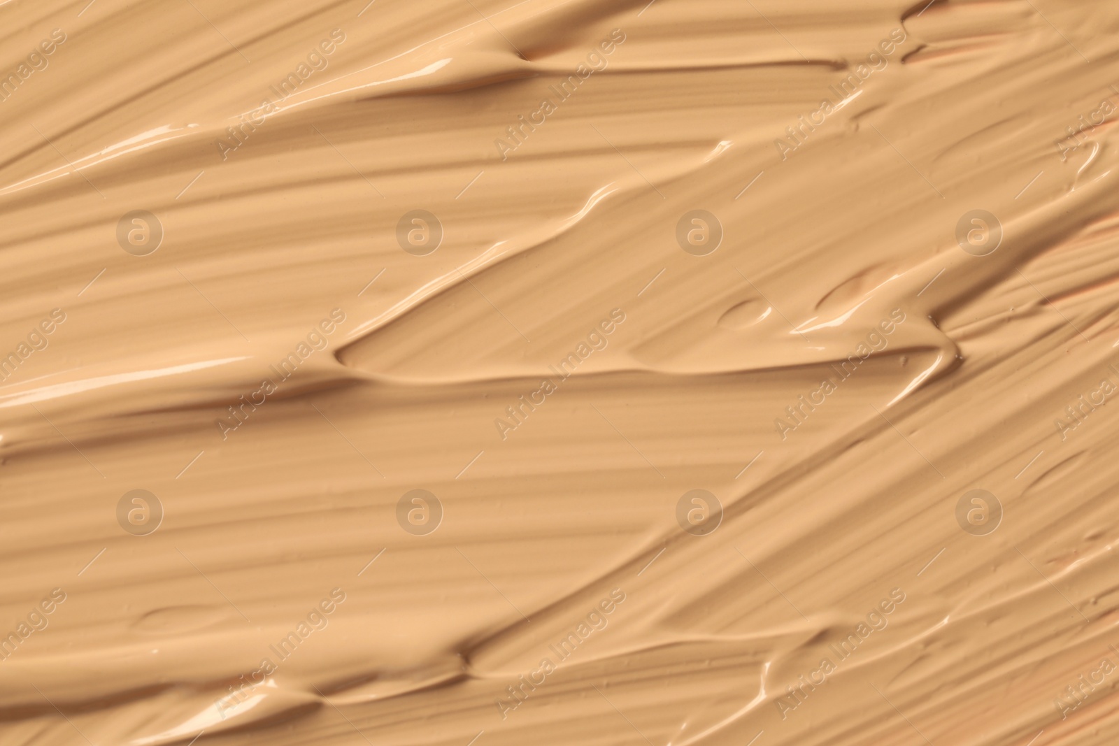 Photo of Texture of liquid skin foundation as background, closeup