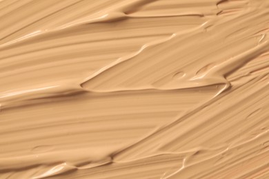 Texture of liquid skin foundation as background, closeup