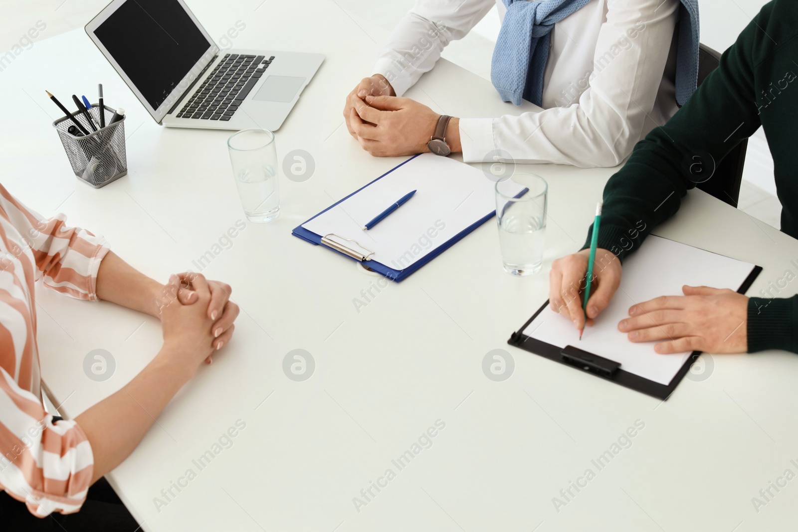 Photo of Human resources commission conducting job interview with applicant in office