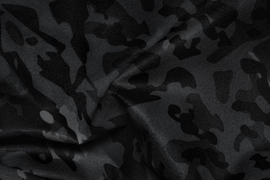 Image of Texture of crumpled camouflage fabric as background, top view. Black and white effect