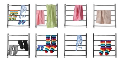 Image of Set with modern heated towel rails with clothes and towels on white background 