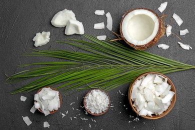 Composition with fresh coconut flakes on dark background