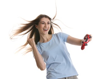 Happy woman playing video games with controller on white background