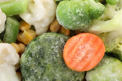 Photo of Mix of different frozen vegetables as background, closeup