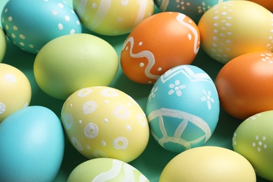 Many beautiful painted Easter eggs as background, closeup