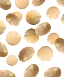 Many lentils falling on white background. Vegan diet 