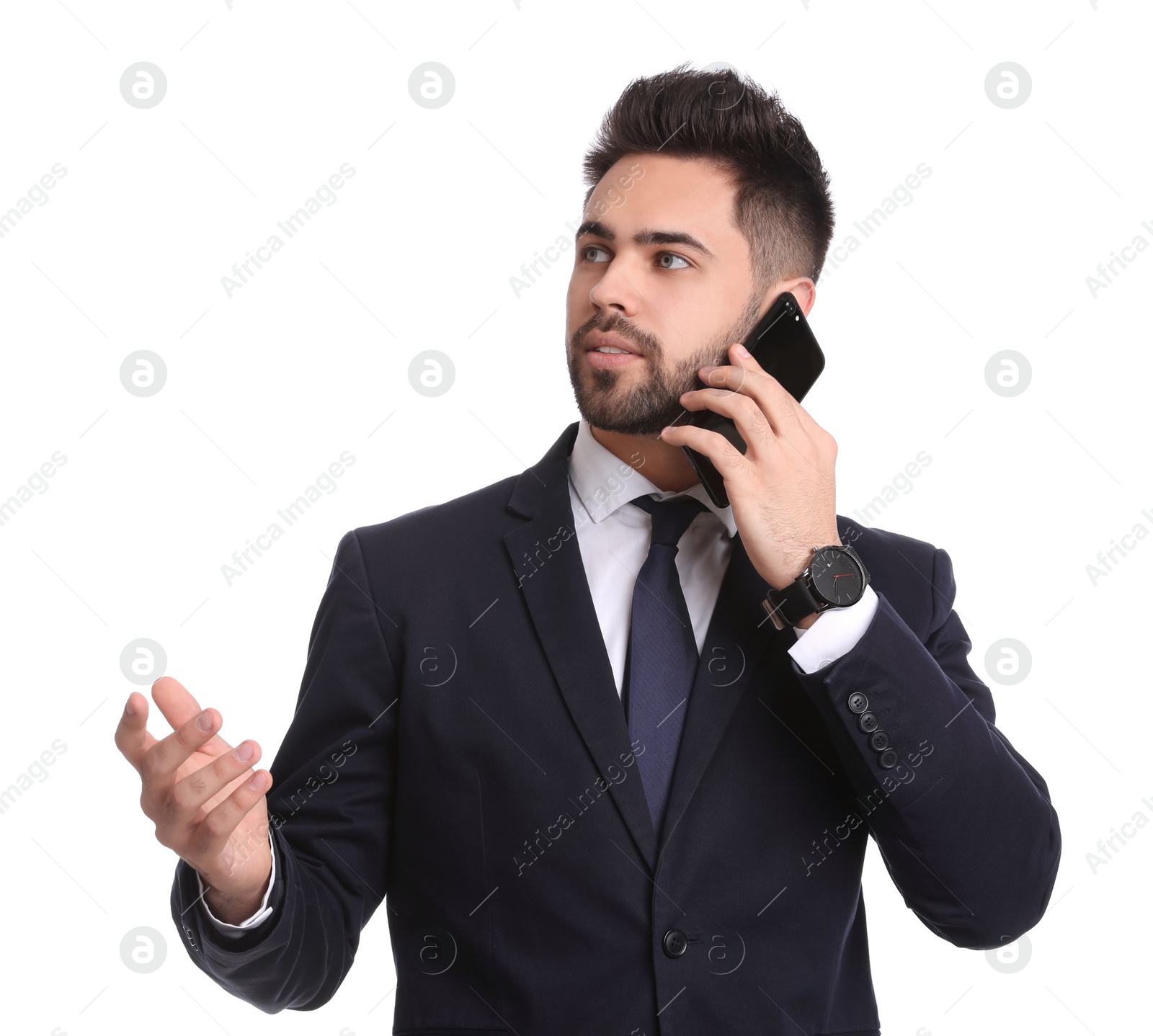 Photo of Young businessman talking on smartphone against white background