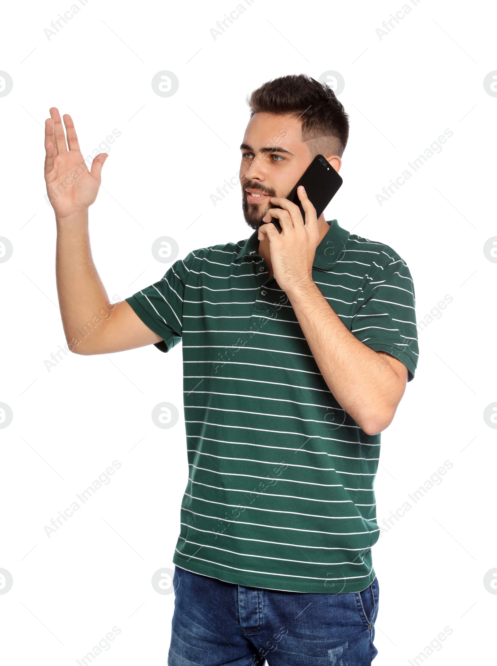 Photo of Portrait of handsome young man with mobile phone on white background