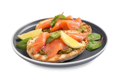 Photo of Delicious bruschettas with salmon and pesto sauce on white background