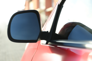 Photo of Side rear view mirror of modern car outdoors