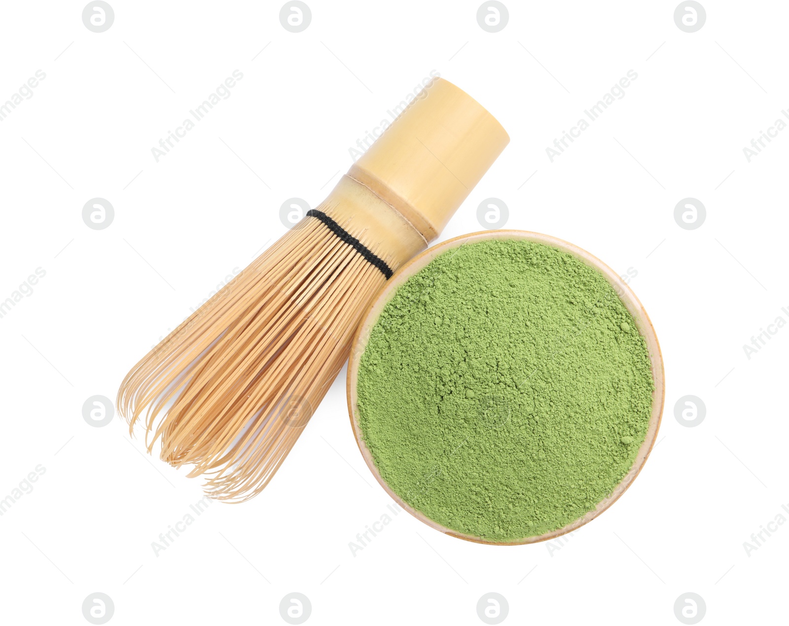 Photo of Bamboo whisk and bowl with matcha powder isolated on white, top view