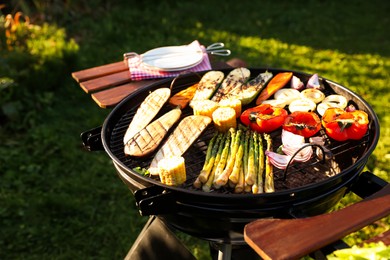 Delicious grilled vegetables on barbecue grill outdoors