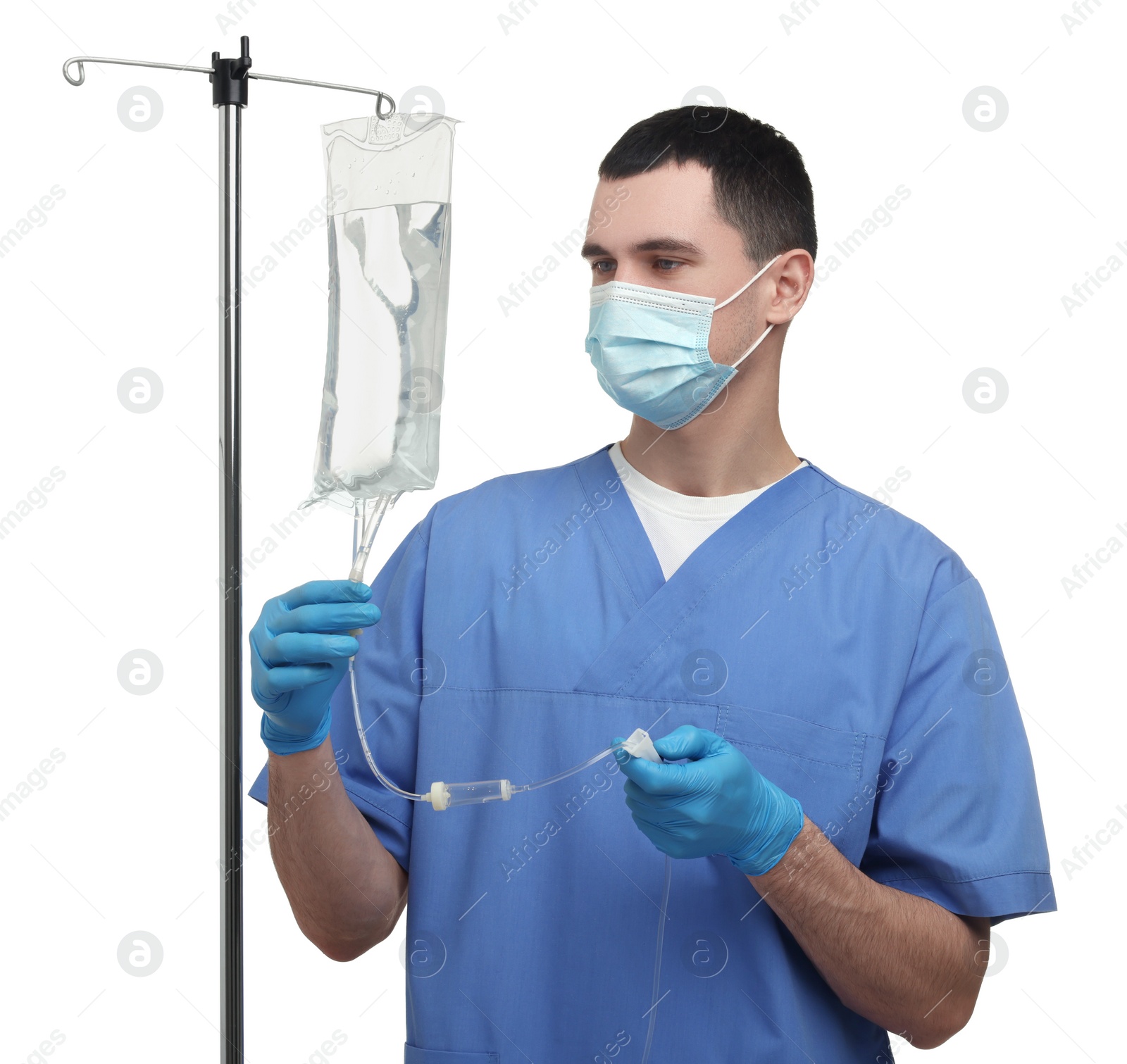 Photo of Nurse setting up IV drip on white background