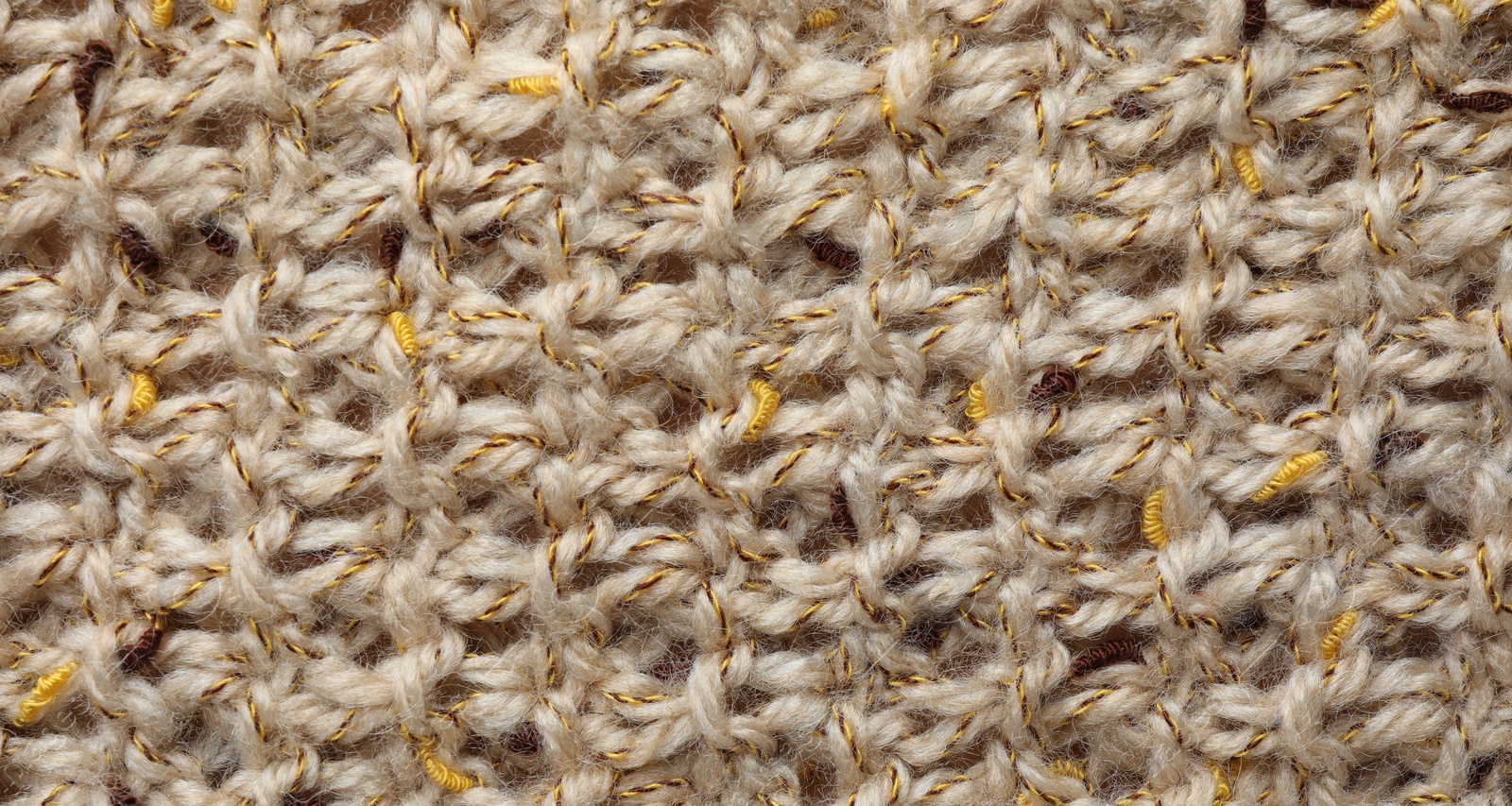 Photo of Texture of knitted fabric as background, top view