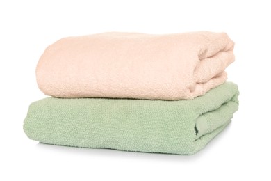 Folded soft terry towels on white background