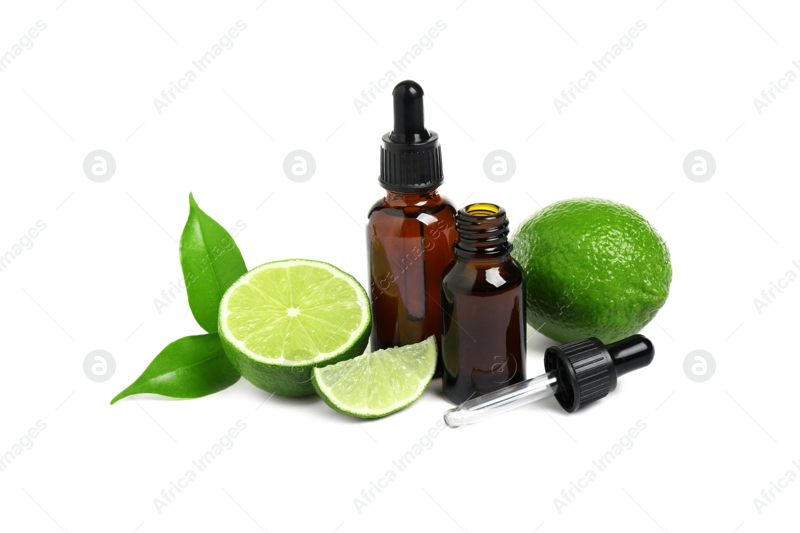 Photo of Lime essential oil in bottles and citrus fruits isolated on white