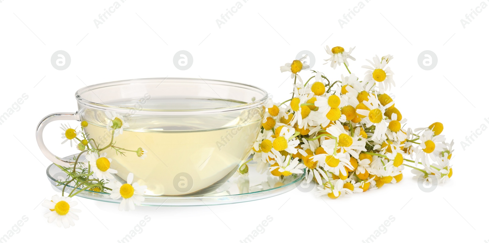 Photo of Aromatic herbal tea in glass cup with chamomile flowers isolated on white