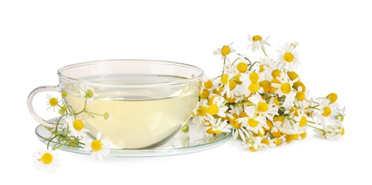 Photo of Aromatic herbal tea in glass cup with chamomile flowers isolated on white