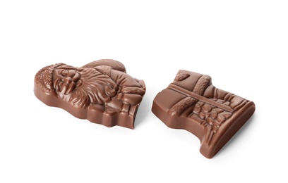 Photo of Pieces of chocolate Santa Claus candy on white background