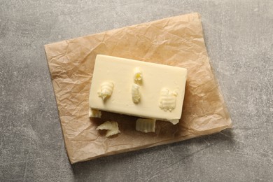 Tasty butter on grey table, top view