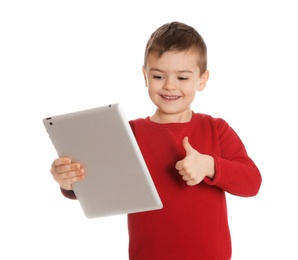 Little boy using video chat on tablet against white background