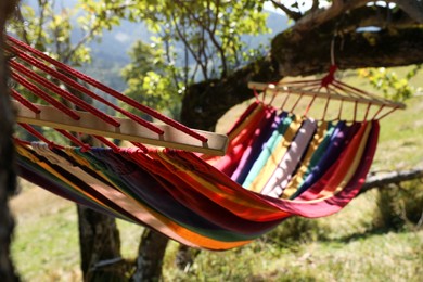 Photo of Empty comfortable hammock in mountains on sunny day